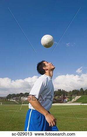 Stock Image - Soccer Player Heading a Ball. Fotosearch