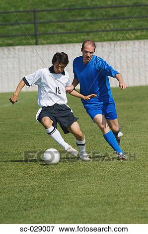 Soccer Player Protecting the Ball View Large Photo Image Stock Photo - Soccer Player Protecting the Ball. Fotosearch