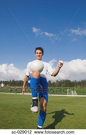 Soccer Player Stalling a Ball View Large Photo Image Stock Image - Soccer Player Stalling a Ball. Fotosearch