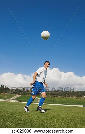 Stock Photograph - Soccer Player Taking a Break. Fotosearch