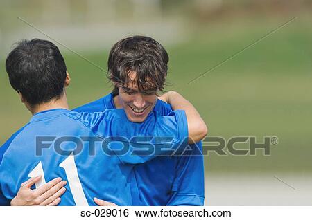 Stock Photograph - Soccer Players Celebrating. Fotosearch