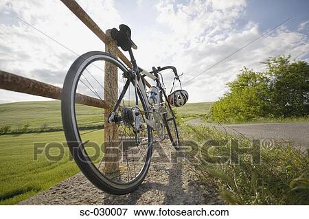 Racer bike parked on roadside by the railing View Large Photo Image Stock Photo - Racer bike parked on roadside by the railing. Fotosearch