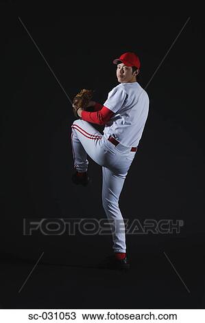 Stock Image - Pitcher Throwing Baseball. Fotosearch
