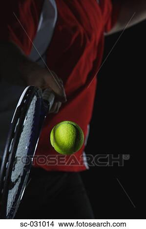Picture - Tennis Player Swinging at Ball. Fotosearch