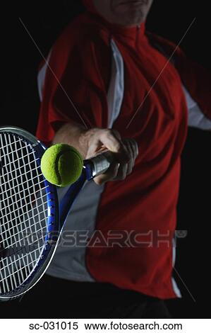 Stock Photography - Tennis Player Swinging at Ball. Fotosearch