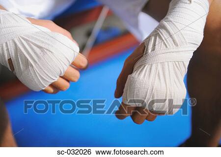 Boxer's hand and knuckles tied with bandage View Large Photo Image Stock Photograph - Boxer's hand and knuckles tied with bandage. Fotosearch