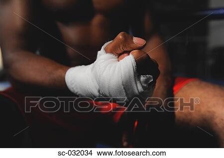 Picture - Boxer's hand wrapped in bandage. Fotosearch