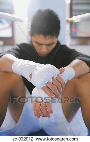 Stock Image - Japanese boxer wearing bandage in his both hands. Fotosearch