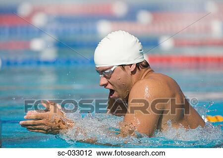 Stock Image - Athlete doing breaststroke swimming stroke. Fotosearch