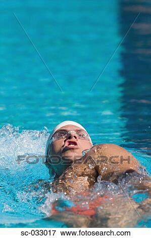Stock Photo - Australian athlete doing backstroke. Fotosearch
