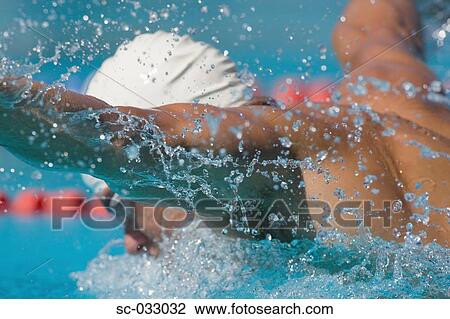 Stock Image - Australian swimmer doing butterfly stroke. Fotosearch