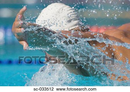 Stock Image - Australian swimmer doing butterfly stroke. Fotosearch