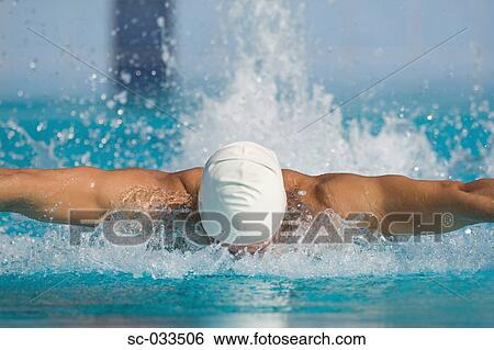 Stock Photograph - Australian swimmer doing butterfly stroke. Fotosearch