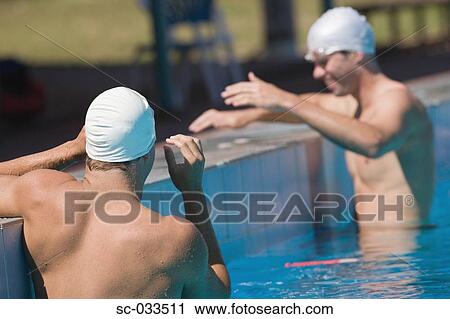 Australian swimmers standing at starting line in pool View Large Photo Image Stock Image - Australian swimmers standing at starting line in pool. Fotosearch