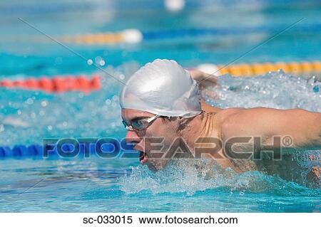 Stock Photography - Young athlete doing butterfly stroke. Fotosearch