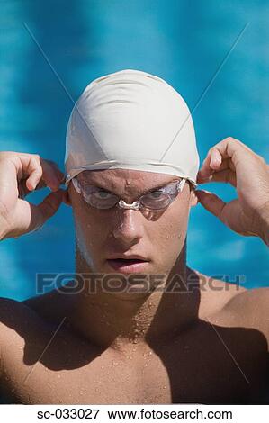 Stock Photo - Young australian swimmer wearing swimming cap. Fotosearch