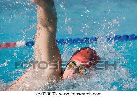 Young swimmer doing front crawl swimming stroke View Large Photo Image Stock Image - Young swimmer doing front crawl swimming stroke. Fotosearch