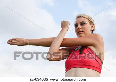 Young Woman with arm outstretched View Large Photo Image Stock Photography - Young Woman with arm outstretched. Fotosearch