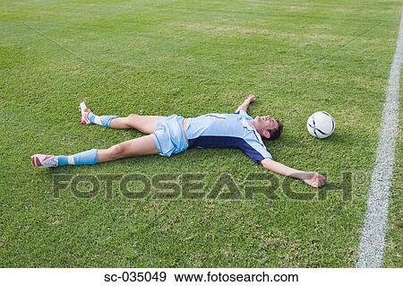 Stock Photo - Exhausted soccer player. Fotosearch