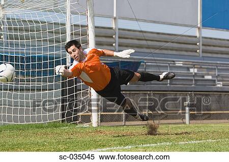 Stock Photography - Goalkeeper diving for a save. Fotosearch