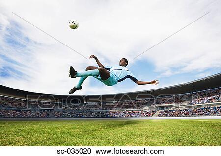 Soccer player performing aerial kick View Large Photo Image Stock Image - Soccer player performing aerial kick. Fotosearch