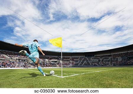 Stock Image - Soccer player taking a corner kick. Fotosearch