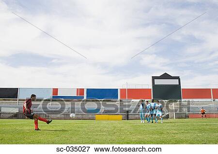 Soccer player taking a freekick View Large Photo Image Stock Photo - Soccer player taking a freekick. Fotosearch