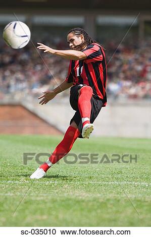 Soccer player taking a shot View Large Photo Image Stock Image - Soccer player taking a shot. Fotosearch