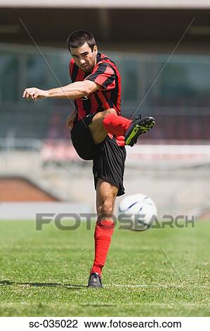 Soccer player taking a shot View Large Photo Image Stock Image - Soccer player taking a shot. Fotosearch