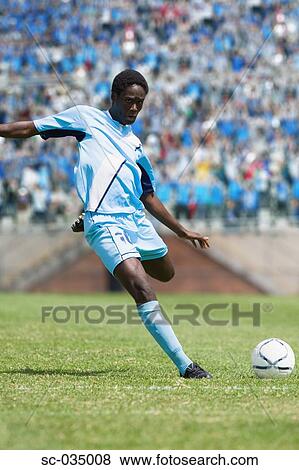 Soccer player taking a shot View Large Photo Image Stock Photo - Soccer player taking a shot. Fotosearch