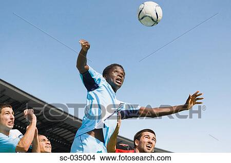 Soccer players jumping for header View Large Photo Image Picture - Soccer players jumping for header. Fotosearch