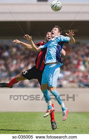 Stock Photography - Soccer players jumping for header. Fotosearch