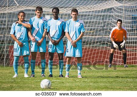 Wall lined up to defend a freekick View Large Photo Image Stock Photo - Wall lined up to defend a freekick. Fotosearch