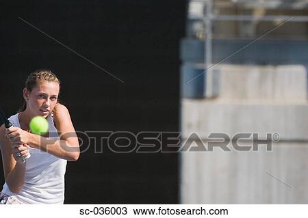 Female tennis player hitting backhand View Large Photo Image Stock Image - Female tennis player hitting backhand. Fotosearch