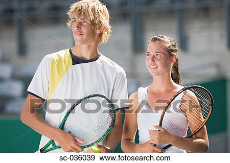Stock Photo - Tennis mixed doubles pair. Fotosearch