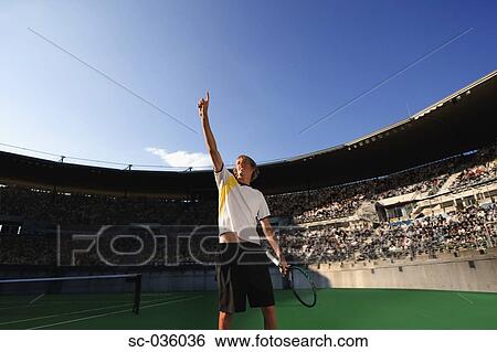 Stock Photograph - Tennis player celebrating victory. Fotosearch