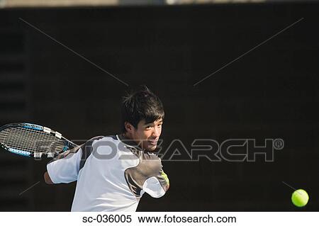 Stock Photography - Tennis player hitting backhand return. Fotosearch