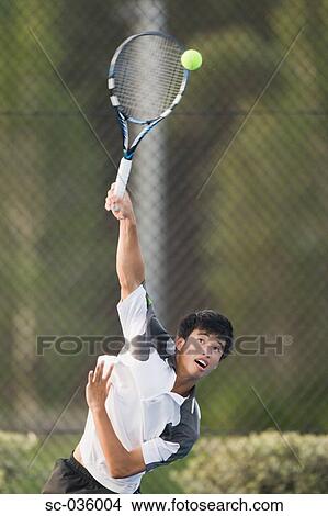 Picture - Tennis player serving. Fotosearch
