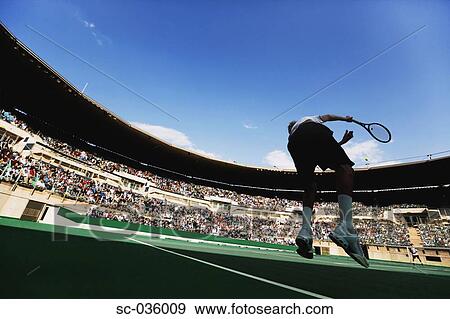 Tennis player serving View Large Photo Image Stock Photo - Tennis player serving. Fotosearch