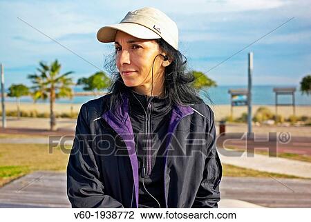 -Woman Listening Music- Gold Coast (Spain). View Large Photo Image Stock Image - -Woman Listening Music- Gold Coast (Spain).. Fotosearch