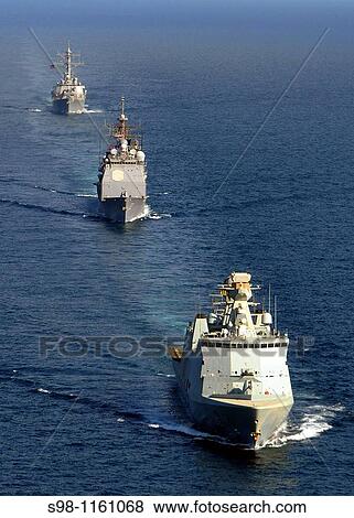 Stock Photo - 090220-N-1082Z-094 GULF OF ADEN Feb 20, 2009 The Dutch flexible support ship HDMS Absalon L 16, front, the guided-missile cruiser USS Vella Gulf CG 72 and the guided-missile destroyer USS Mahan DDG 72 transit the Gulf of Aden. Fotosearch