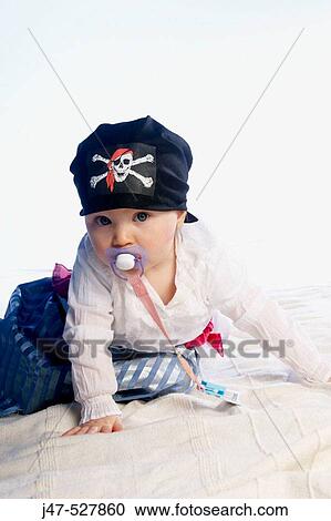 1 year old girl dressed up in a pirates costume with a dummy in her mouth View Large Photo Image Stock Image - 1 year old girl dressed up in a pirates costume with a dummy in her mouth. Fotosearch