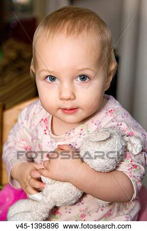 1 year old girl with cuddly toy. View Large Photo Image Stock Photograph - 1 year old girl with cuddly toy.. Fotosearch