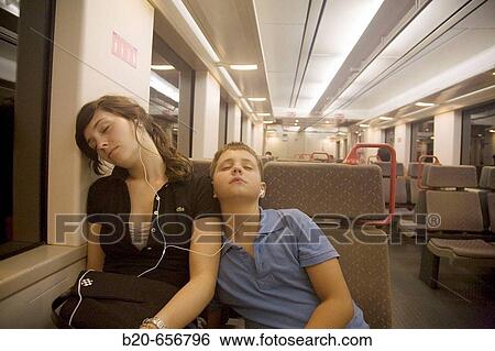 10 and 18 year old brother and sister in commuter train using iPod View Large Photo Image Stock Photograph - 10 and 18 year old brother and sister in commuter train using iPod. Fotosearch