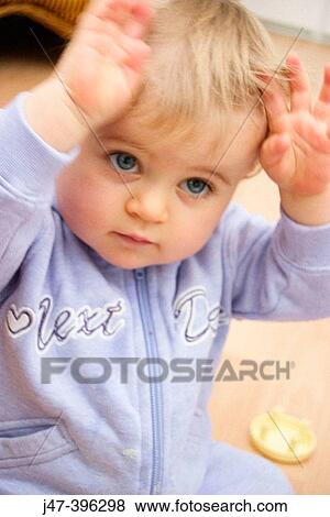 10 month old baby arms in the air, big blue eyes View Large Photo Image Stock Photo - 10 month old baby arms in the air, big blue eyes. Fotosearch