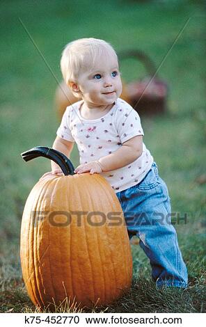 10 mouth old child with pumpkin View Large Photo Image Stock Image - 10 mouth old child with pumpkin. Fotosearch