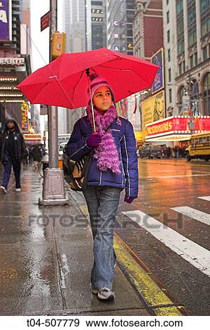 10-year-old biracial girl at Times Square in the rain, NYC. USA View Large Photo Image Stock Photo - 10-year-old biracial girl at Times Square in the rain, NYC. USA. Fotosearch