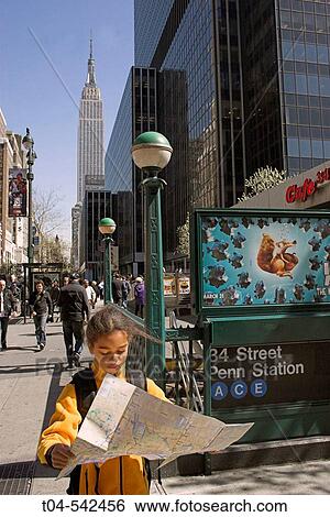 10-year-old biracial girl on looking at subway map, Empire State Building in rear. New York City. USA. View Large Photo Image Stock Photograph - 10-year-old biracial girl on looking at subway map, Empire State Building in rear. New York City. USA.. Fotosearch