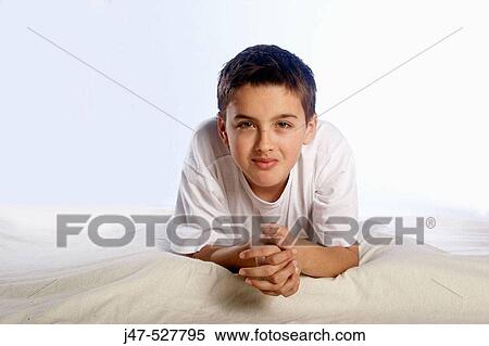10 year old boy lying on the floor, smiling into camera View Large Photo Image Stock Photography - 10 year old boy lying on the floor, smiling into camera. Fotosearch