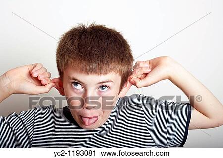 10 year old boy pulling a funny face in the studio View Large Photo Image Stock Image - 10 year old boy pulling a funny face in the studio. Fotosearch